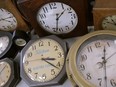 Antique clocks are displayed at the Electric Time Company, in Medfield, Massachusetts on March 5, 2020.