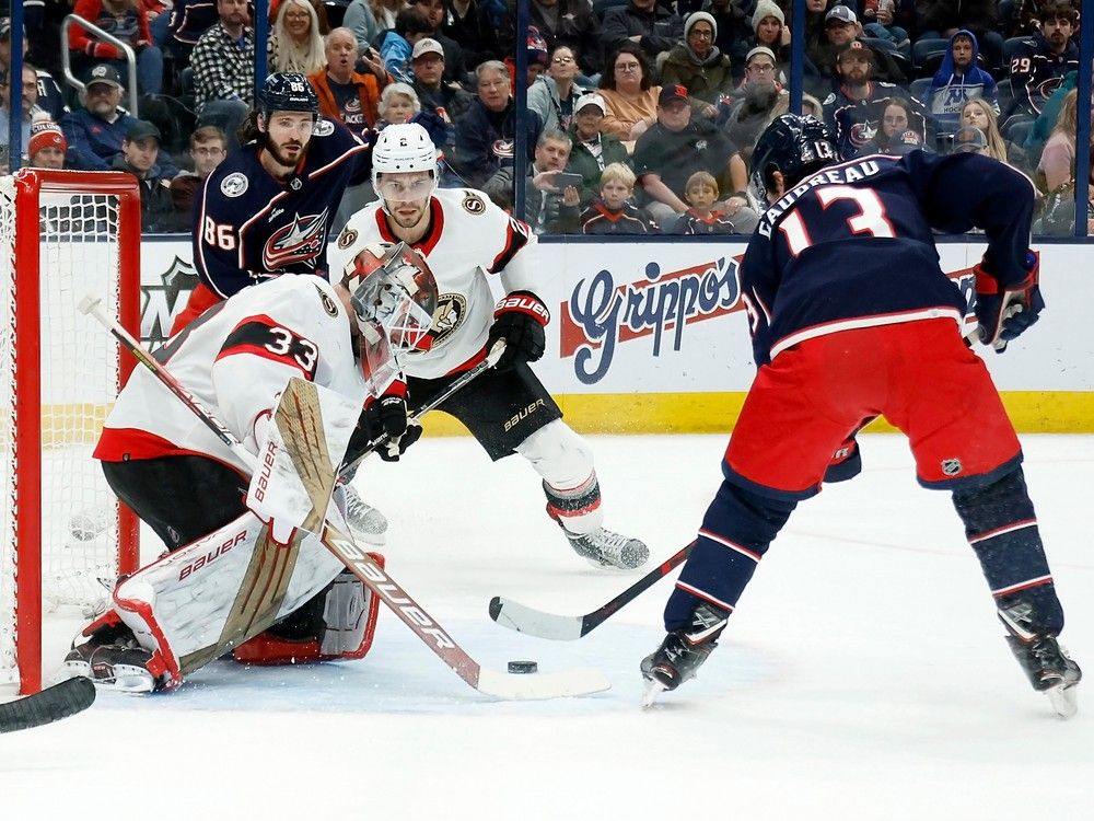 Cam Talbot of the Ottawa Senators stops a shot from Johnny Gaudreau of the Columbus Blue Jackets during the second period.