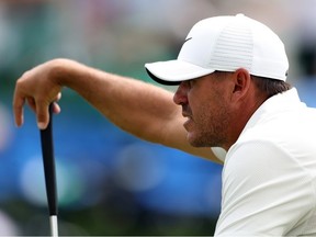 Brooks Koepka of the United States looks over a putt on the 18th green during the second round of the 2023 Masters Tournament at Augusta National Golf Club on April 07, 2023 in Augusta, Georgia.