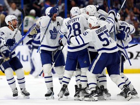 The Toronto Maple Leafs celebrate an overtime goal by Ryan O'Reilly during Game 3 of the first round of the 2023 Stanley Cup playoffs against the Tampa Bay Lightning at Amalie Arena on Monday, April 22, 2023 in Tampa, Fla.