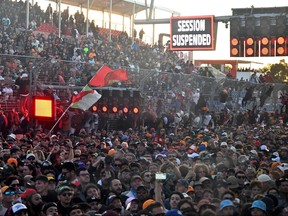 Spectators wait for the race to resume during the 2023 Formula One Australian Grand Prix at the Albert Park Circuit in Melbourne on April 2, 2023.