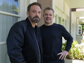 Ben Affleck, left, and Matt Damon pose for a portrait to promote the film "Air" at the Four Seasons Hotel in Los Angeles.