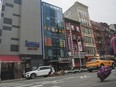 A six-story glass facade building, second from left, is believed to be the site of a foreign police outpost for China in New York's Chinatown, Monday, April 17, 2023.