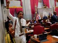 Justin Jones caries his name tag after a vote at the Tennessee House of Representatives to expel him for his role in a gun control demonstration at the statehouse last week, in Nashville, Thursday, April 6, 2023.