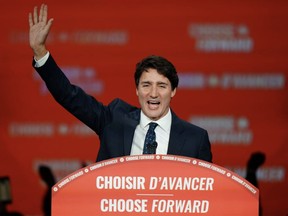 Liberal leader and Prime Minister Justin Trudeau waves on stage after the federal election at the Palais des Congres in Montreal, Oct. 22, 2019.