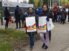 Hundreds of Public Service Alliance of Canada workers picket the Canada Revenue Agency Surrey National Verification and Collection building on King George Blvd. in Surrey, B.C. on Wednesday, April 19, 2023.
