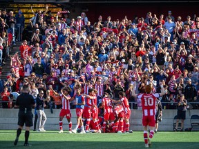 Atlético Ottawa celebrate during a game.