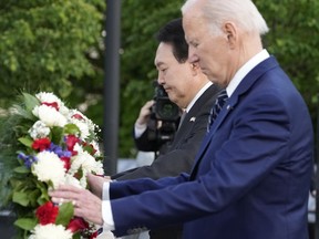 President Joe Biden and South Korea's President Yoon Suk Yeol lay a wreath during a visit to the Korean War Veterans Memorial in Washington, Tuesday, April 25, 2023.