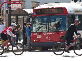Bus and bicycle traffic along Rideau Street in downtown Ottawa on Monday April 5,2010. (ERROL MCGIHON/THE OTTAWA SUN)