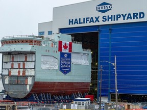The centre block of future Arctic and Offshore Patrol Ship HMCS Max Bernays is moved from the fabrication building to dockside at the Irving Shipbuilding facility in Halifax in January 2021.
