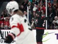 Canadian forward Natalie Spooner, right, celebrates her goal against Switzerland during the first period of Wednesday's game at Brampton, Ont.