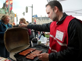 Jean-Paul Surette, a federal public servant with Corrections Canada, has been doling out the hot dogs to fellow picketers in front of the Prime Minister's Office at the corner of Elgin and Wellington Street.