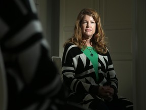 Julie Coulson Fine, 50, had two lumpectomies and a full mastectomy in 2020 in Montreal after she was given an indefinite wait time in Ottawa for surgery following her breast cancer diagnosis. Today she has a clean bill of health and thinks seeking out her own care at a private health clinic possibly saved her life.