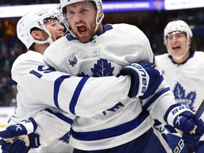 Maple Leafs center Alexander Kerfoot (15) celebrates after he scored the game-winning goal against the Tampa Bay Lightning in overtime of Game 4 in Tampa Monday night.