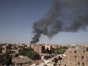 Smoke is seen in Khartoum, Sudan, Wednesday, April 19, 2023. Abd Algadier, a Sudanese citizen of Canada, is mere blocks from the head-quarters of the Rapid Support Forces headquarters, the paramilitary group whose lashing against the Sudan's army has left him unable to return to Canada and in peril on nearly every front.