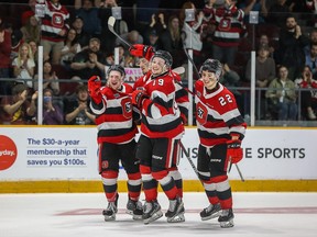 Jack Beck celebrates with 67's teammates after scoring the game-winning goal against the Petes in the third period.