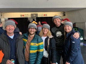 A group of "Rockheads" pose at the 2023 world men's curling championship in  Ottawa.