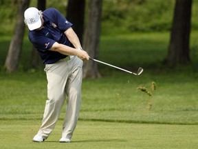 Golfer Brad Fritsch hits a shot