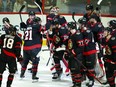 Ottawa Senators winger Claude Giroux (28) is swarmed by teammates as they help him celebrates his 1,000th career point.