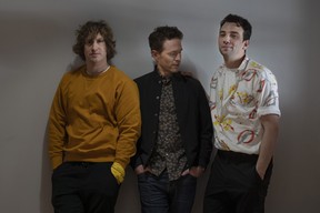 L-R: Matthew Johnson, Glenn Howerton and Jay Baruchel pose for a photo as they promote the film "Blackberry" in Toronto.