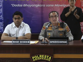 Denpasar District Police Chief Col. Bambang Yugo Pamungkas, right, speaks to the media as Chief Detective Maj. Losa Lusiano Araujo, left, listens during a press conference in Denpasar, Bali, Indonesia, Wednesday, May 17, 2023. Indonesian police investigating the deaths of two Chinese tourists whose bodies were found at a hotel in the resort island of Bali said Wednesday that the boyfriend of the woman killed her before killing himself.