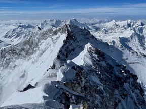 In this file photo taken May 31, 2021, the Himalayan Range is seen from the summit of Mount Everest in Nepal.