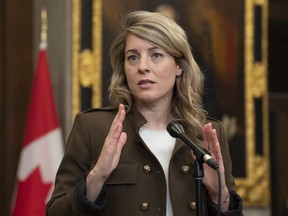 Foreign Affairs Minister Melanie Joly speaks with reporters in the Foyer of the House of Commons about the situation in Sudan, Thursday, April 27, 2023 in Ottawa.