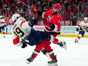 May 18, 2023; Raleigh, North Carolina, USA; Carolina Hurricanes defenseman Jaccob Slavin (74) checks Florida Panthers left wing Matthew Tkachuk (19) during the third overtime period of game one in the Eastern Conference Finals of the 2023 Stanley Cup Playoffs at PNC Arena. Mandatory Credit: James Guillory-USA TODAY Sports     TPX IMAGES OF THE DAY