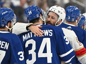 Florida Panther Colin White embraces Toronto Maple Leafs forward Auston Matthews after the Panthers' overtime win  in Game 5 of their second-round series eliminated the Leafs from the 2023 Stanley Cup playoffs.