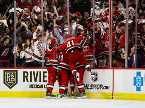Jesper Fast of the Carolina Hurricanes celebrates with his teammates at PNC Arena on May 11, 2023 in Raleigh, North Carolina.