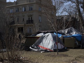 Councillors in Toronto have voted to declare homelessness an emergency in the city and are urging higher levels of government to help them respond to the situation. A homeless encampment in Toronto's Alexandra Park on March 20, 2021.