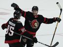 Ottawa Senators defenceman Jake Sanderson races to congratulate  winger Alex DeBrincat on his game-winning goal.