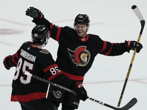 Alex DeBrincat celebrates a game-winning goal.