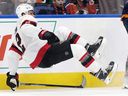 Ottawa Senators' Artem Zub falls to the ice.