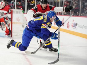 Sweden's Oskar Pettersson fights for position with Austria's Christoph Tialler.