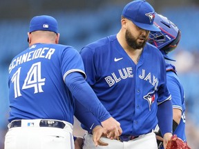Alek Manoah of the Toronto Blue Jays gets pulled from the game by manager John Schneider.