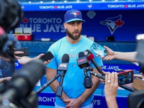 Anthony Bass of the Toronto Blue Jays makes a statement to the media