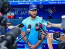 Anthony Bass of the Toronto Blue Jays makes a statement to the media before playing the Milwaukee Brewers at the Rogers Centre on May 30, 2023.