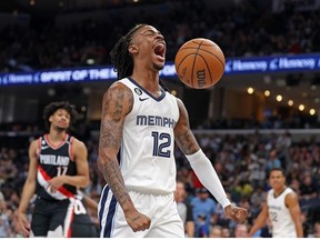 Ja Morant of the Memphis Grizzlies reacts during the first half against the Portland Trail Blazers at FedExForum on April 04, 2023 in Memphis, Tennessee.