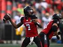 Making his first CFL start, Redblacks quarterback Tyrie Adams throws a pass during the first half of Friday's game against the Elks.