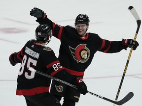 Ottawa Senators Jake Sanderson races to congratulate Alex DeBrincat on his game winning goal.