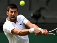 Novak Djokovic of Serbia plays a backhand against Hubert Hurkacz of Poland.