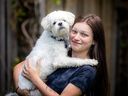 Chanelle Lafleche, 25, and her dog, Everest, on Sunday, July 23, 2023. Lafleche, who has a rare genetic sub-type of cystic fibrosis, is among about 10 per cent of CF patients who are not approved for Trikafta in Canada. Many describe the drug as a miracle for people with CF.