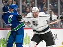 Zack MacEwen, then with the Los Angeles Kings, hits Akito Hirose of the Vancouver Canucks during the second period of a game on April 2.