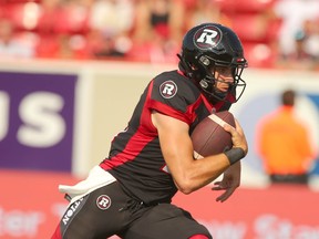 Ottawa QB Dustin Crum runs the ball during CFL action between the Ottawa Redblacks and Calgary Stampeders at McMahon Stadium in Calgary on Sunday, July 23, 2023.