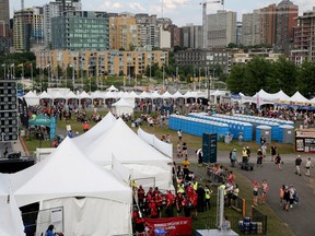 People arrive at Bluesfest July 6, 2023. Festival organizers are keeping an eye on the weather after a tornado watch was put in place for the Ottawa region Thursday.