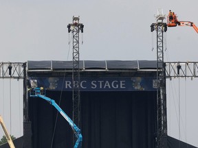 Crews tear down the stages at Ottawa Bluesfest Monday morning at Lebreton Flats. Over 300,000 people are believed to have attended Bluesfest this year.