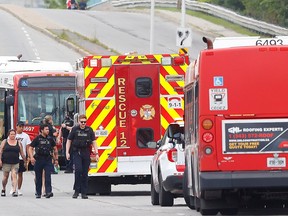Ottawa police investigate a collision between a pedestrian and an OC Transpo bus near the corner of St. Laurent Boulevard and Tremblay Road in Ottawa Thursday.