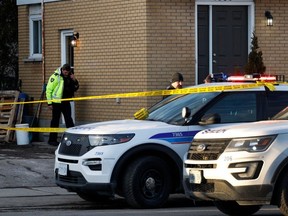 Ottawa Police Service officers at the scene of the incident at a Walkley Road residence on March 8.