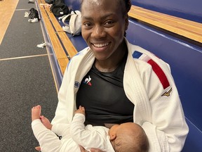 French judoka Clarisse Agbegnenou breast-feeds her baby.